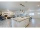 Open floor plan kitchen featuring a large island with barstool seating and bright lighting at 10844 N 37Th St, Phoenix, AZ 85028