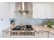 Close up on the kitchen featuring granite counters, a tile backsplash, and a stainless steel gas range at 10844 N 37Th St, Phoenix, AZ 85028