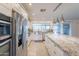 Bright kitchen featuring stainless steel appliances, a granite island, and ample counter space at 10844 N 37Th St, Phoenix, AZ 85028
