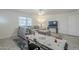 Cozy living room with plush sectional sofa, stylish rug, and ample natural light at 10844 N 37Th St, Phoenix, AZ 85028