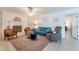 Well-lit living room with fireplace, comfortable seating, and a neutral color palette at 10844 N 37Th St, Phoenix, AZ 85028