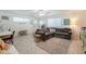 Cozy living room featuring a comfortable sectional sofa and a functional workspace at 10844 N 37Th St, Phoenix, AZ 85028