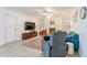 Bright living room with a decorative fireplace, modern furniture, and wood-look tile floors at 10844 N 37Th St, Phoenix, AZ 85028