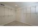 A spacious walk-in closet provides an abundance of shelving with modern flooring at 10844 N 37Th St, Phoenix, AZ 85028