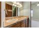 The bathroom features dual sinks, and the design includes natural stone and stylish fixtures at 11141 E North Ln, Scottsdale, AZ 85259