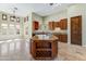 This spacious kitchen is equipped with an island with a wine rack and ample storage space at 11141 E North Ln, Scottsdale, AZ 85259