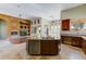 Expansive kitchen overlooking the living area, featuring a large center island with seating and lots of cabinet space at 11141 E North Ln, Scottsdale, AZ 85259
