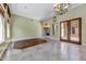 Spacious living room featuring travertine tile and a decorative tile accent at 11141 E North Ln, Scottsdale, AZ 85259