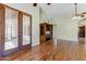 Bright living room with wood floors and views to the outside at 11141 E North Ln, Scottsdale, AZ 85259