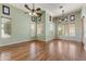 Bright living room with wood floors, multiple windows, and ceiling fans at 11141 E North Ln, Scottsdale, AZ 85259