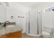 Bathroom featuring a single sink vanity and shower with white shower curtain at 11823 N 76Th Way, Scottsdale, AZ 85260