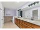 Bathroom with tile flooring, double sink vanity, and granite counters at 11823 N 76Th Way, Scottsdale, AZ 85260