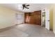 Large carpeted bedroom with built-in storage cabinets and backyard access at 11823 N 76Th Way, Scottsdale, AZ 85260