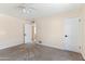 Clean bedroom with carpet, white trim, and a ceiling fan at 11823 N 76Th Way, Scottsdale, AZ 85260