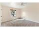 Cozy bedroom with neutral walls, carpet, and natural light from a large window at 11823 N 76Th Way, Scottsdale, AZ 85260