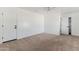 Carpeted bedroom with white walls and ceiling fan at 11823 N 76Th Way, Scottsdale, AZ 85260