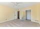 Light and airy bedroom with carpet, ceiling fan and mirrored closet at 11823 N 76Th Way, Scottsdale, AZ 85260