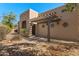 Inviting front entrance with a pergola and Southwestern inspired architecture, great curb appeal at 11823 N 76Th Way, Scottsdale, AZ 85260