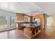 This bright kitchen boasts a central island, light wood cabinets, and stainless steel appliances at 11823 N 76Th Way, Scottsdale, AZ 85260
