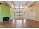Large living room with wood floors, beamed ceilings, and glass doors that bring the outside in at 11823 N 76Th Way, Scottsdale, AZ 85260