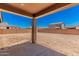 A spacious backyard with a covered patio awaiting a personal touch at 12373 W Marguerite Ave, Avondale, AZ 85323