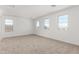 Large, bright bedroom features ample natural light, neutral carpet and fresh paint at 12373 W Marguerite Ave, Avondale, AZ 85323