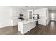 Bright kitchen with white cabinets, stainless steel appliances, and a large center island at 12373 W Marguerite Ave, Avondale, AZ 85323