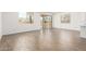Bright living room area with wood-look tile flooring and large sliding glass doors at 12373 W Marguerite Ave, Avondale, AZ 85323