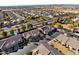 Aerial view of neighborhood, showcasing well-maintained homes and landscaping at 1475 N Agave St, Casa Grande, AZ 85122