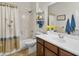 Cozy bathroom with a combined bathtub and shower, a clean single sink, and fresh linens and towels at 1475 N Agave St, Casa Grande, AZ 85122