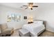 Light and airy bedroom features neutral decor and a comfortable sitting area bathed in natural light at 1475 N Agave St, Casa Grande, AZ 85122