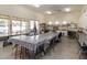 Bright craft room with large tables, storage cabinets, and a sink area at 1475 N Agave St, Casa Grande, AZ 85122