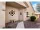 Inviting front entrance with decorative art, bench and desert landscaping at 1475 N Agave St, Casa Grande, AZ 85122