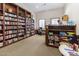 Inviting library with floor-to-ceiling bookshelves and a dedicated workspace at 1475 N Agave St, Casa Grande, AZ 85122