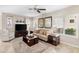 Bright living room features tile flooring, cozy seating, and stylish decor with lots of natural light at 1475 N Agave St, Casa Grande, AZ 85122