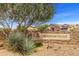 Entrance to Ironwood Village with a stone sign and desert landscaping at 1475 N Agave St, Casa Grande, AZ 85122