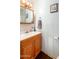 Cozy bathroom featuring a wood vanity and a framed mirror and cabinet at 1779 S 74Th St, Mesa, AZ 85209