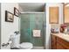 Bathroom featuring a shower with glass doors and a wood vanity at 1779 S 74Th St, Mesa, AZ 85209
