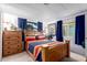 Bedroom with a bed, nightstand, dresser, and window with curtains at 1779 S 74Th St, Mesa, AZ 85209