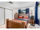 Cozy bedroom with wood furniture, including a bed, dressers, and nightstands at 1779 S 74Th St, Mesa, AZ 85209