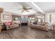 Spacious living room boasting wood-look floors, comfortable sofas, and a large television at 1779 S 74Th St, Mesa, AZ 85209