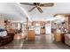 Open floor plan with an island and view of the living room featuring wood-look floors and modern finishes at 1779 S 74Th St, Mesa, AZ 85209
