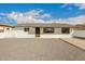 Cozy single-story home with a gravel front yard and black trimmed windows at 1799 S Coconino Dr, Apache Junction, AZ 85120