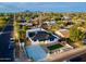 Bird's eye view of a well-placed home near the mountains, highlighting landscaping and street access at 2202 E Osborn Rd, Phoenix, AZ 85016