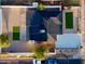 Aerial view of the property highlighting its roof, landscaping, and surrounding fence at 2202 E Osborn Rd, Phoenix, AZ 85016