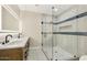 Modern bathroom boasts dual sinks, a glass shower, and stylish tile accents at 2202 E Osborn Rd, Phoenix, AZ 85016