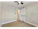 Bedroom featuring new wood-look flooring, neutral walls, a ceiling fan, and closet doors at 2202 E Osborn Rd, Phoenix, AZ 85016