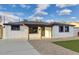 Charming single story home with a fresh exterior, covered entryway, and a well-maintained front yard at 2202 E Osborn Rd, Phoenix, AZ 85016