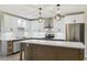 Modern kitchen featuring white cabinets, stainless steel appliances, and a center island at 2202 E Osborn Rd, Phoenix, AZ 85016