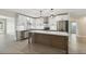 Modern kitchen featuring white cabinets, stainless steel appliances, and a center island at 2202 E Osborn Rd, Phoenix, AZ 85016